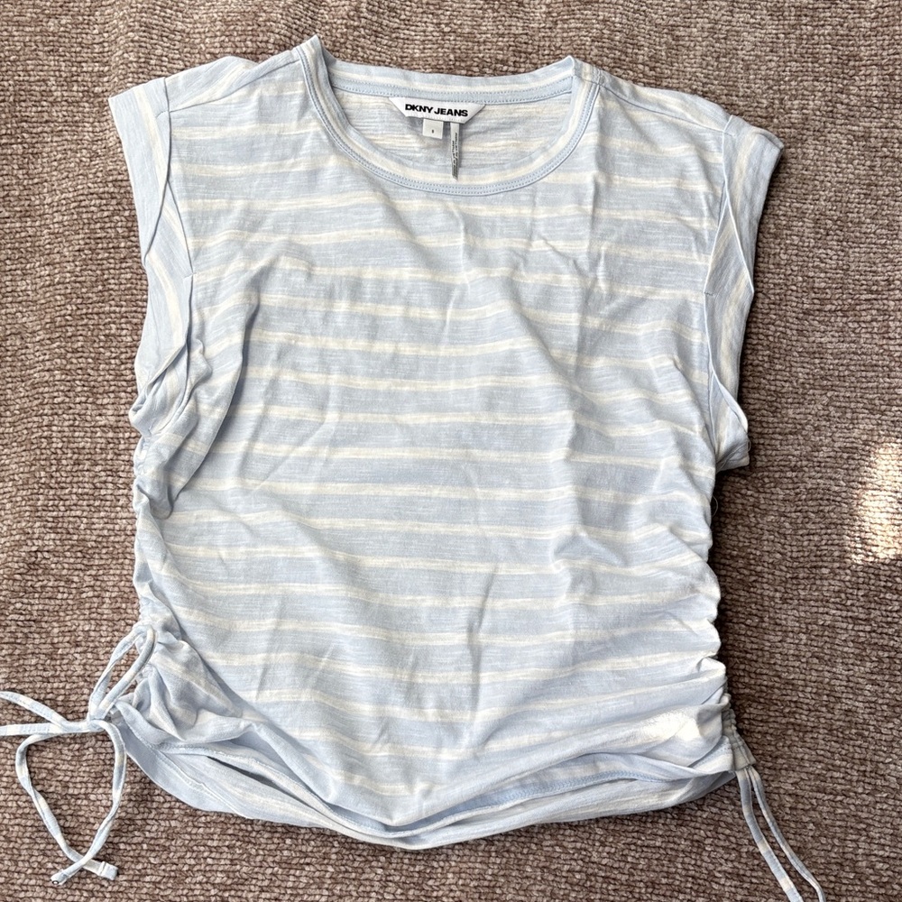 Cute sleeveless summer top. Never worn. Pale blue and white stripe. Small.